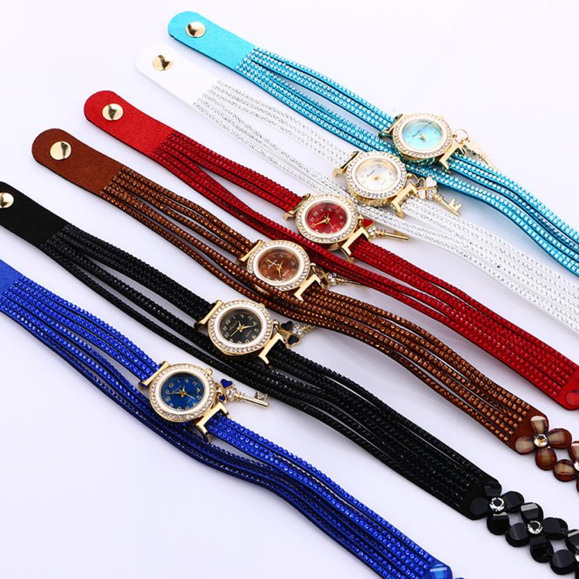 Key and Flowers Bracelet Watch Women This watch has all the best elements of the past, present and future. The modern, easy to read watch features a key hanging off the side and a attached flower design bracelet. You can tell time in an easy and efficient manner with this easy to read watch.