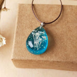 Load image into Gallery viewer, Dried Flowers Necklace Necklace, Women Enjoy a piece of the outdoors alive at your very neck. This flower in a necklace has been specially picked and dried before being pressed in clear blue glass pendant, reminiscing the outdoors out of doors without having to leave your home.
