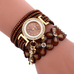Load image into Gallery viewer, Key and Flowers Bracelet Watch Women This watch has all the best elements of the past, present and future. The modern, easy to read watch features a key hanging off the side and a attached flower design bracelet. You can tell time in an easy and efficient manner with this easy to read watch.
