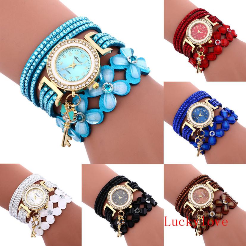 Key and Flowers Bracelet Watch Women This watch has all the best elements of the past, present and future. The modern, easy to read watch features a key hanging off the side and a attached flower design bracelet. You can tell time in an easy and efficient manner with this easy to read watch.