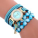 Load image into Gallery viewer, Key and Flowers Bracelet Watch Women This watch has all the best elements of the past, present and future. The modern, easy to read watch features a key hanging off the side and a attached flower design bracelet. You can tell time in an easy and efficient manner with this easy to read watch.

