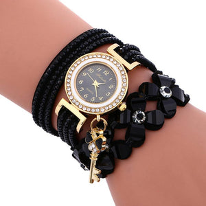 Key and Flowers Bracelet Watch Women This watch has all the best elements of the past, present and future. The modern, easy to read watch features a key hanging off the side and a attached flower design bracelet. You can tell time in an easy and efficient manner with this easy to read watch.