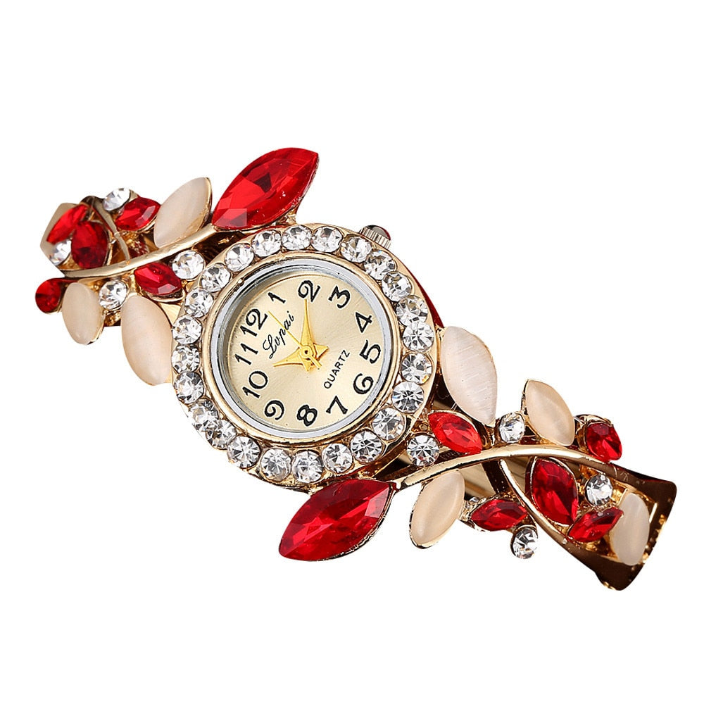 Crystal Leaf Bracelet Watch Women Fresh in your garden of time, this Crystal Leafs Bracelet Watch tells you every chapter of the story without skipping the pages. An array of dangling crystals and very pretty face designed exclusively for women go a long way into making your timetelling experience better than it already is.